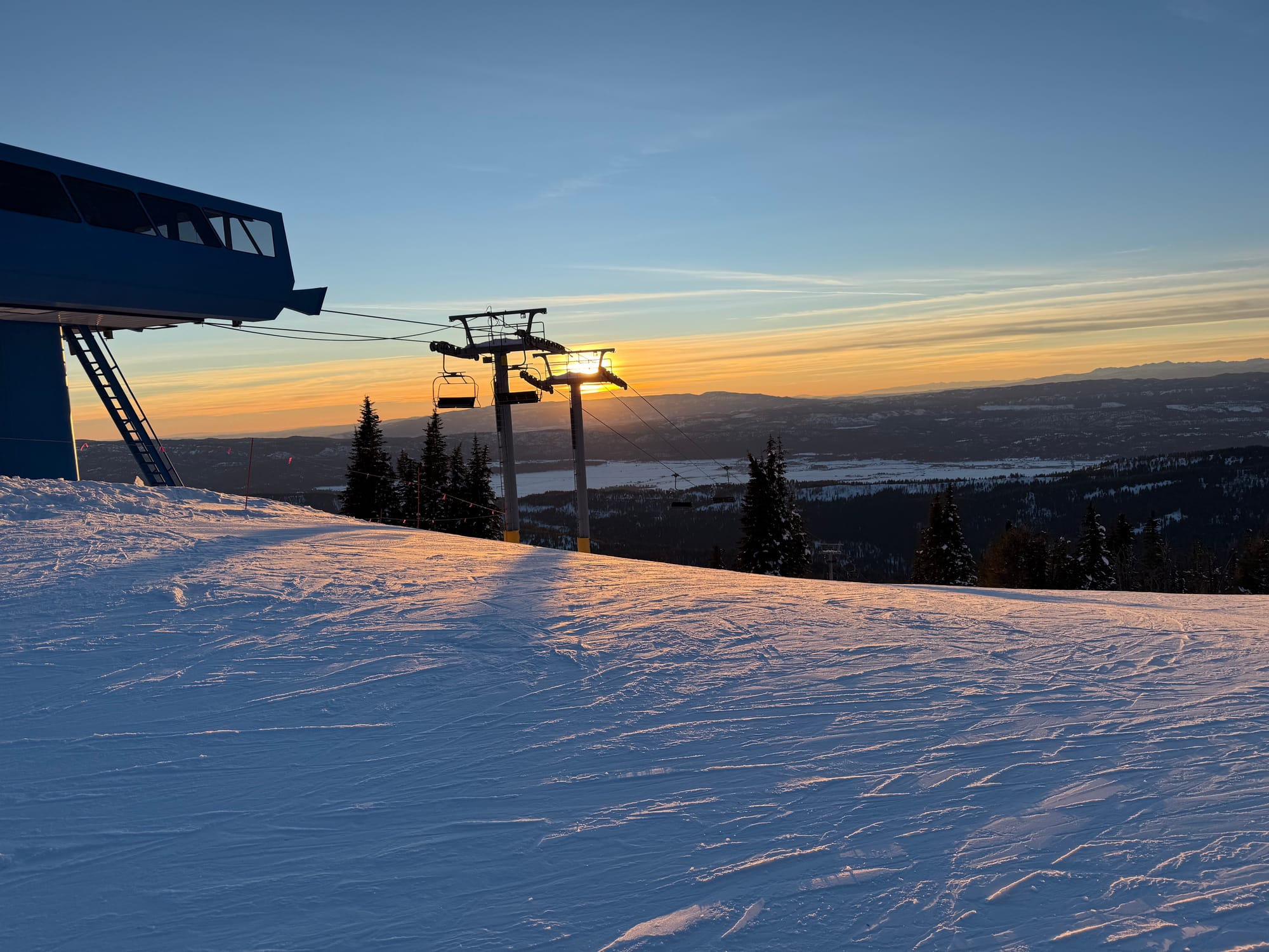 Picture of ski lift at sunset. 
