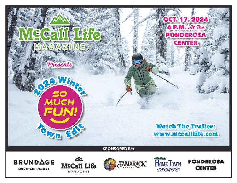 Picture of skier in powder skiing through the trees. 