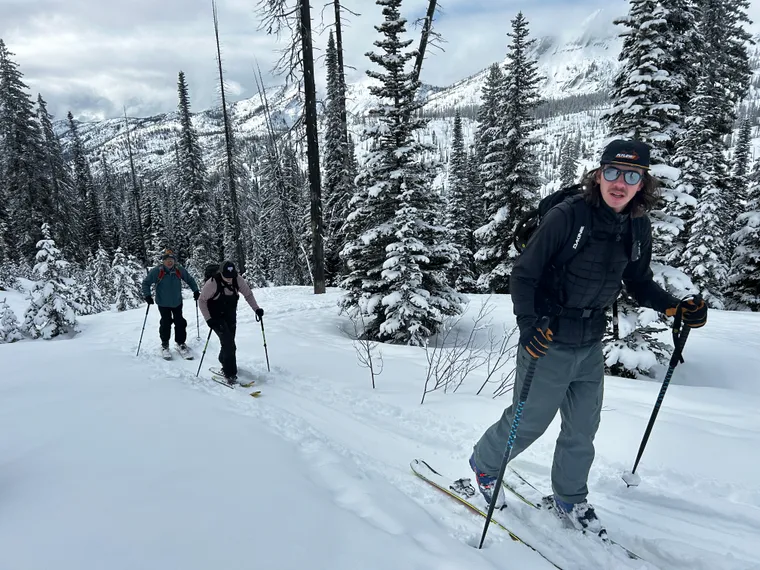 Picture of three backcountry skiers in the woods.
