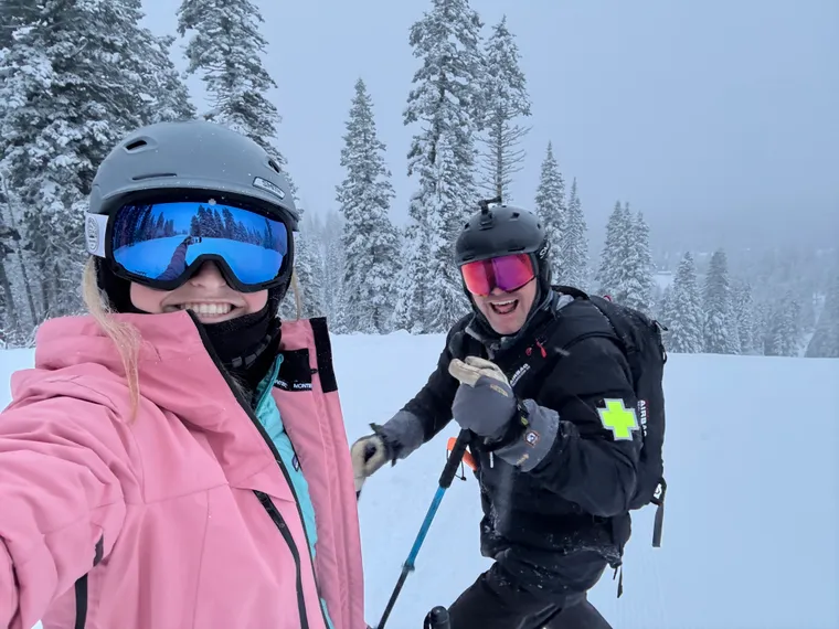 Picture of girl and ski patroller. 