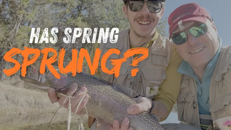 Picture of two fly fishermen holding Rainbow Trout